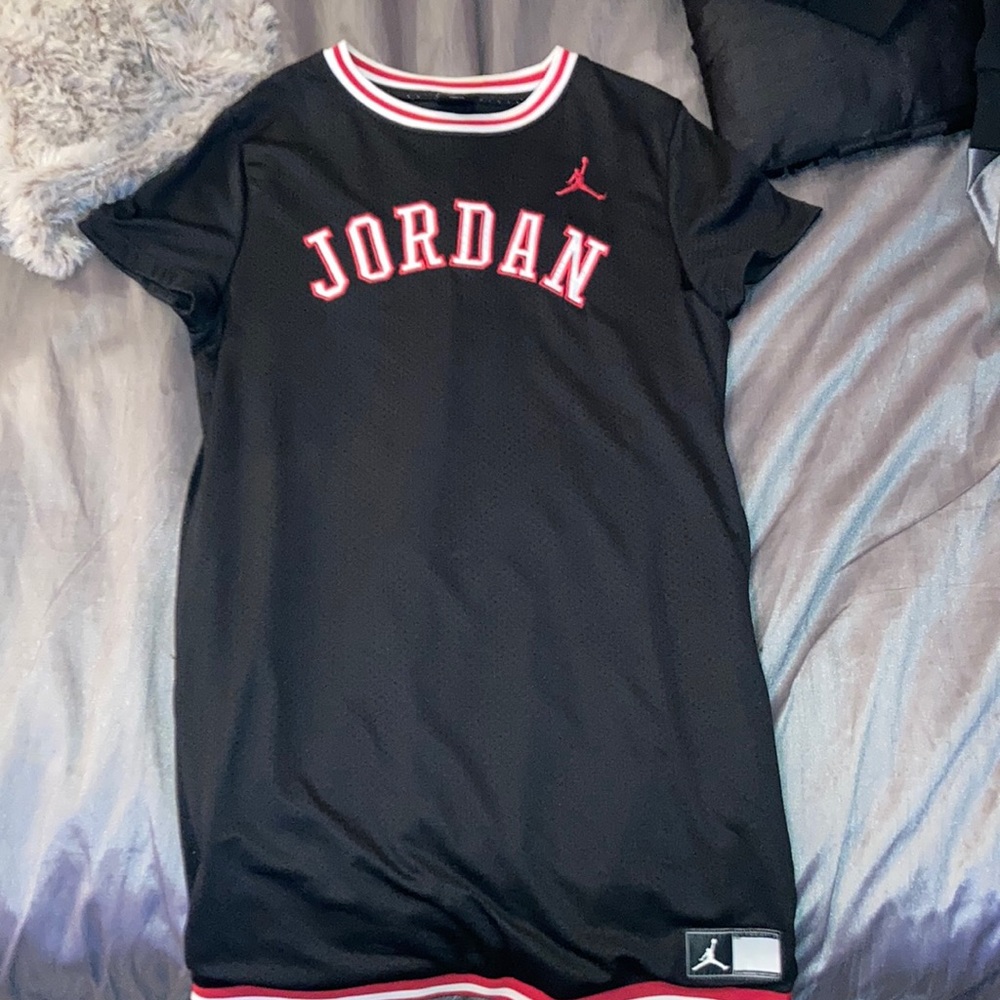 A dress/shirt, has pockets & if you like Jordan clothes this is perfect for you!